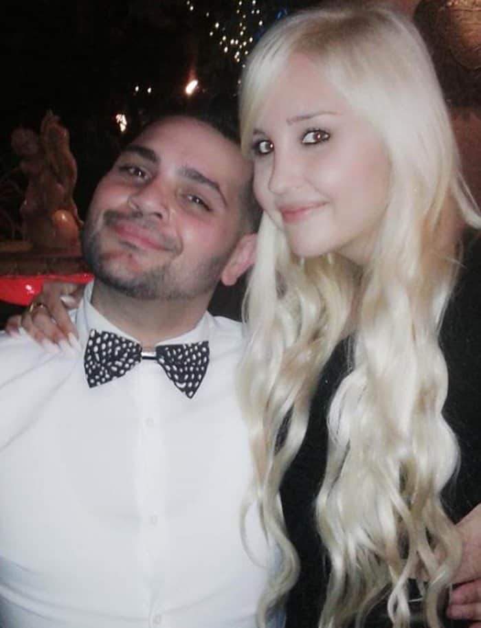 Amanda Bynes with Michael Costello at the SOAR Los Angeles Gala, wearing long platinum blonde hair and sharing a smile for the camera
