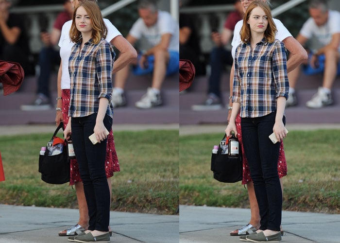 Emma Stone layered a classic plaid button-down over dark skinny jeans and completed the casual look with her go-to green TOMS slip-ons