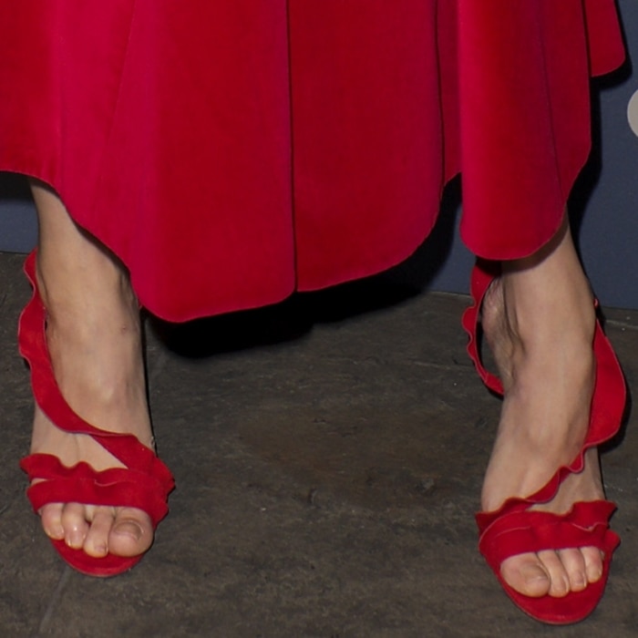 Gemma Arterton shows off her pedicure in red Aquazzura ruffled suede sandals