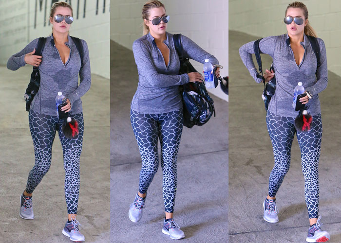 Khloé Kardashian pairs her Nike Flyknit Lunar 3 sneakers with giraffe-print Nike Pro leggings and a matching Dri-Fit half-zip pullover for a stylish gym-ready look in Los Angeles