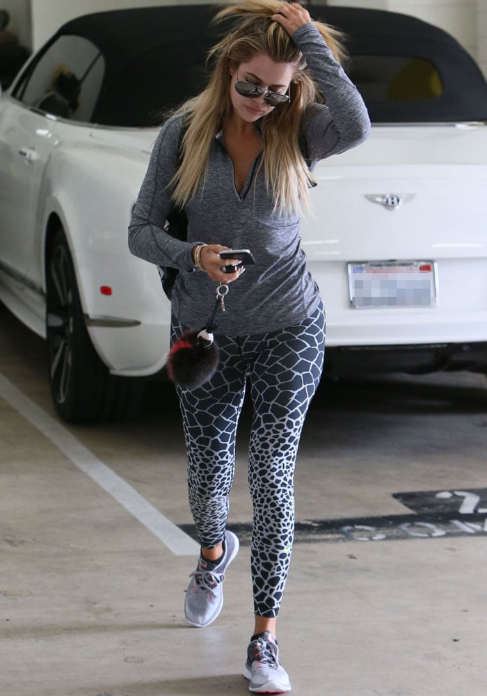 Khloé Kardashian lets her long highlighted hair down following a gym visit