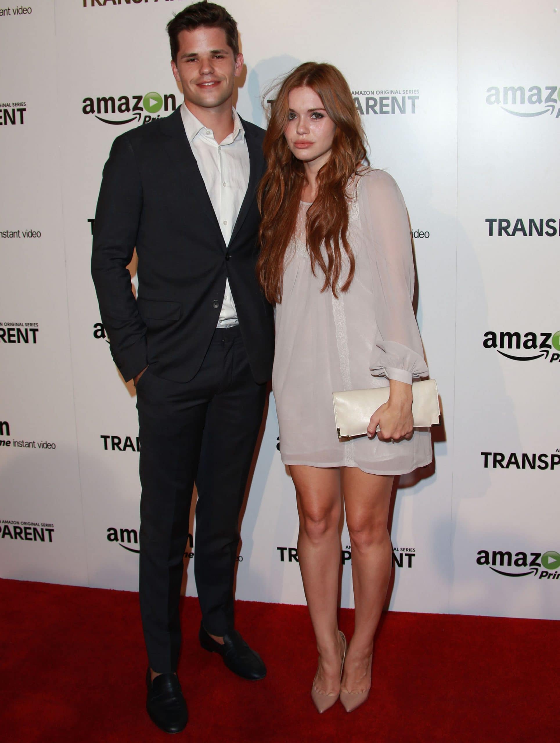 Holland Roden and Max Carver attended the Transparent premiere, with Roden looking chic in a flowy sheer mini dress paired with nude pointed-toe heels and a matching clutch, while Carver opted for a sleek, classic black suit