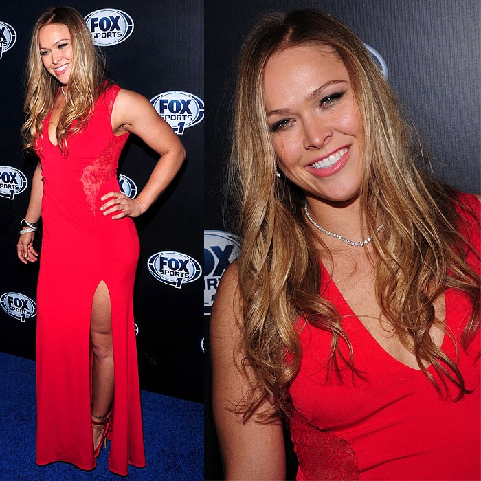 Ronda Rousey steps out at the 2013 Fox Sports Upfront After-Party in a curve-skimming red gown with a thigh-high slit, the bold hue and streamlined silhouette framing her strappy heels and athletic, defined stance