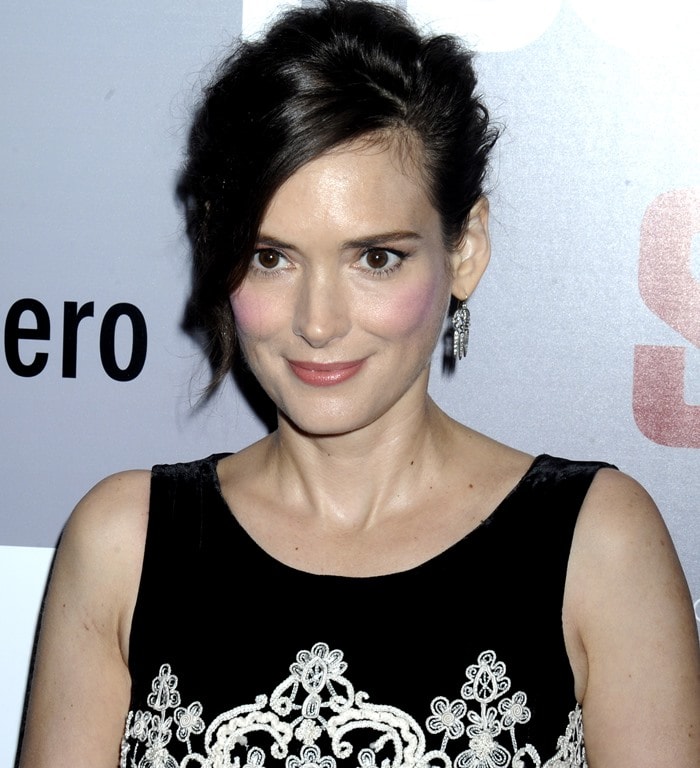 Wearing sparkling drop earrings and soft pink makeup, Winona Ryder brings a touch of vintage glamour to the Show Me a Hero red carpet
