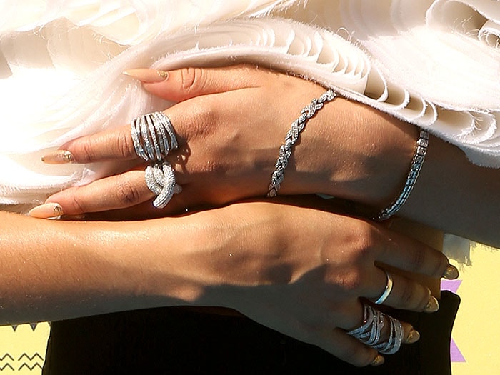 Zendaya flashes her bedazzled hands and fingernails to the cameras