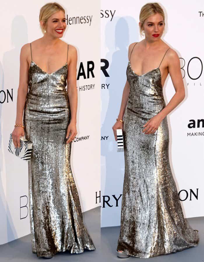 Sienna Miller dazzles in a shimmering silver slip dress with delicate spaghetti straps, pairing the ’90s-inspired gown with metallic open-toe heels at the amfAR Cinema Against AIDS Gala during the Cannes Film Festival on May 21, 2015