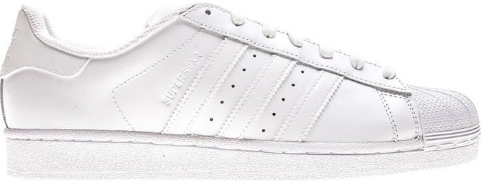 Classic white Adidas Superstar sneakers feature a smooth leather upper, signature shell toe, and timeless three-stripe detailing—an everyday icon built for effortless street style