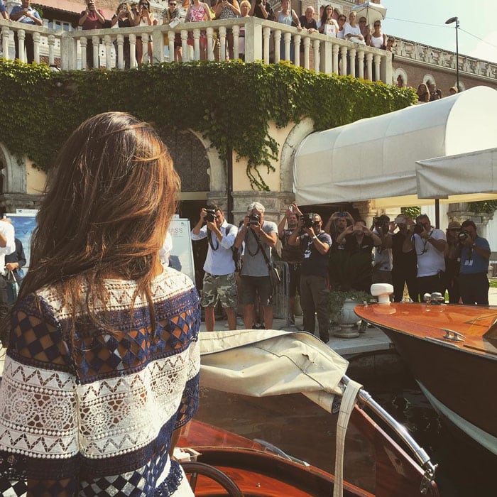 Alessandra Ambrosio uploads a photo of herself surrounded by photographers in Venice with the caption, "Ciao Belli ✨🇮🇹✨ #Venezia #venicefilmfestival"