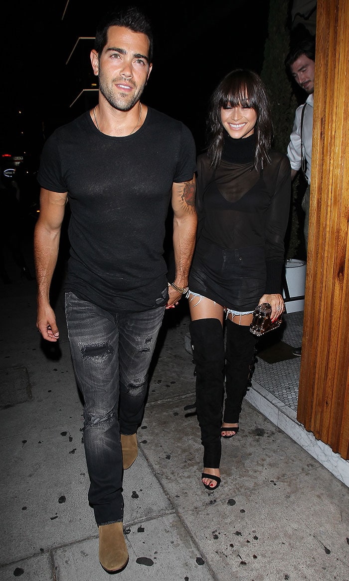 Cara Santana and Jesse Metcalfe coordinate in black outfits as they depart The Nice Guy, with Cara's unique boots capturing attention