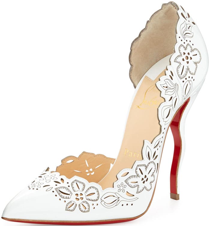 Christian Louboutin “Beloved” pumps in white leather feature delicate floral laser-cut detailing, a scalloped topline, and a sleek stiletto heel finished with the signature red lacquered sole