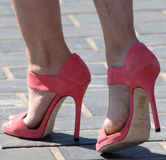 Emily Blunt's pink suede Jimmy Choo "Lee" sandals are stamped size 37 on the sole and finished with slender stiletto heels