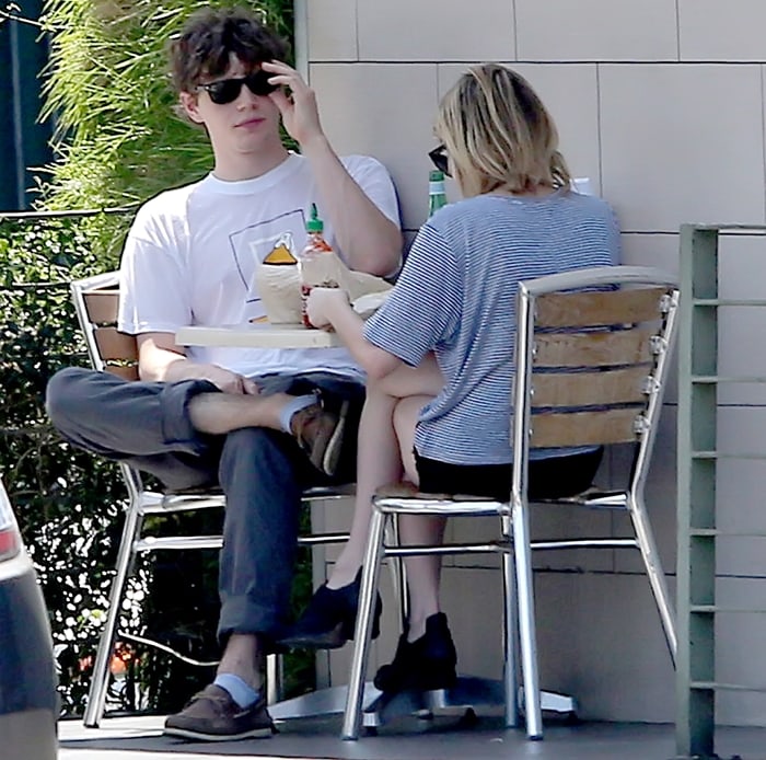 Evan Peters and his girlfriend Emma Roberts enjoy lunch in Los Angeles on August 10, 2012, with Emma wearing striped separates and Alexander Wang “Zoe” oxfords