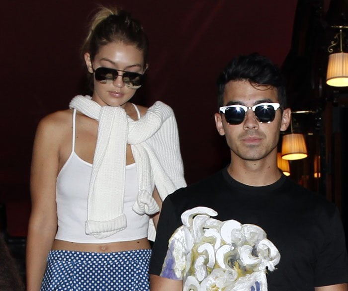 Gigi Hadid and Joe Jonas walk side by side, blending coordinated neutrals and effortless cool during a low-key night out