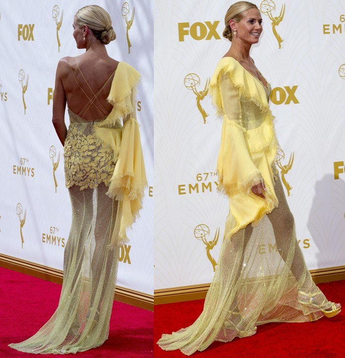 Heidi Klum struts the red carpet at the Emmys in a polarizing yellow Versace gown and matching gold sandals that drew comparisons to Big Bird