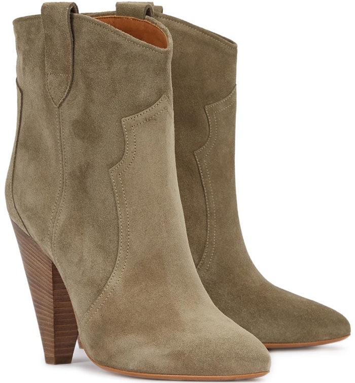 Isabel Marant Étoile "Roxann" Sand Suede Ankle Boots feature the brand's signature blend of Parisian ease and Western influence, crafted in washed sand suede with a streamlined pull-on silhouette, subtly pointed almond toes, and towering stacked cone heels that elongate the leg while maintaining a relaxed, bohemian feel