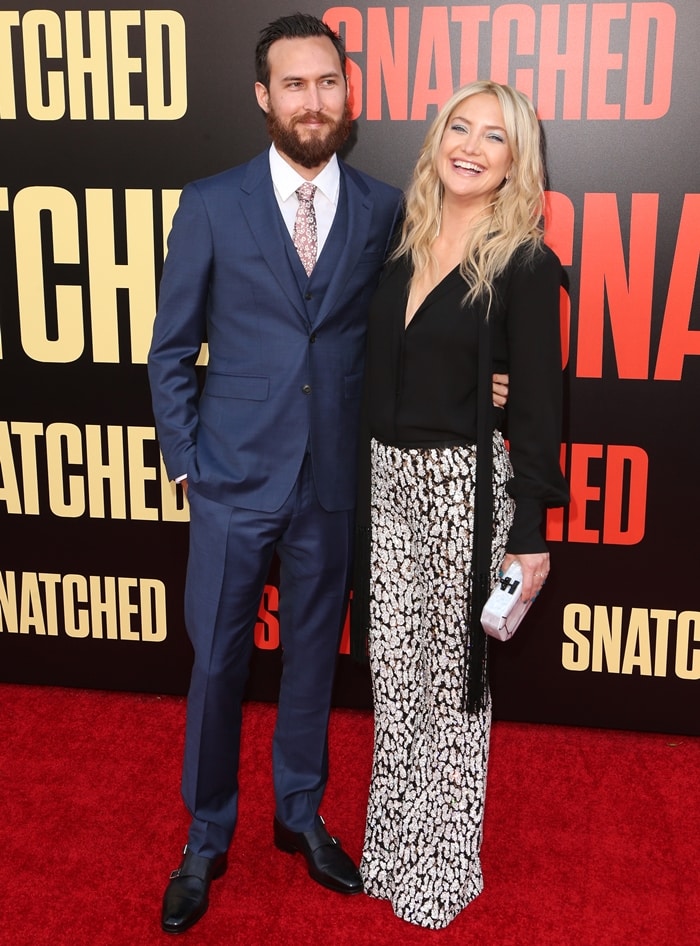 Kate Hudson debuts sleek Giuseppe Zanotti strappy heels alongside Danny Fujikawa at their first red-carpet appearance as a couple at the 2017 Snatched premiere in Westwood