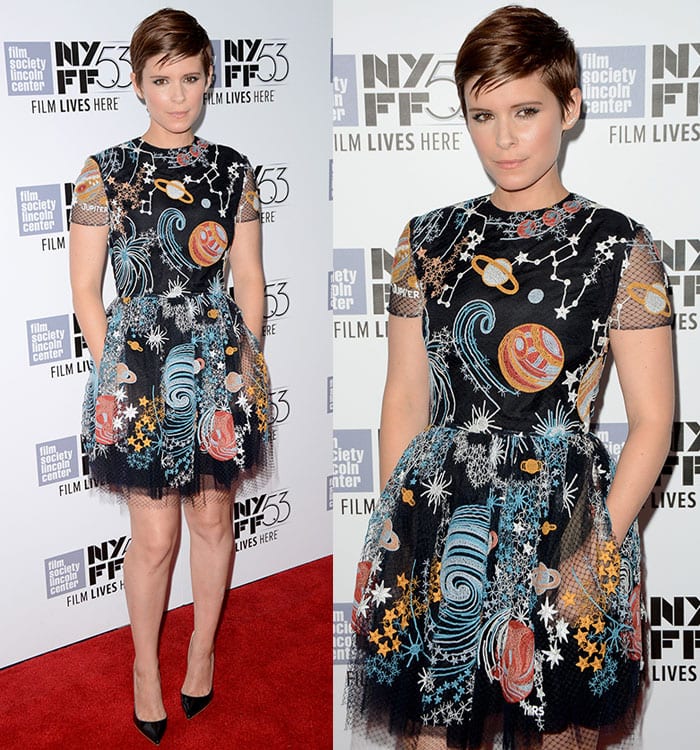 Kate Mara shows off the pockets of her space-themed Valentino dress on the red carpet of the New York premiere of "The Martian"