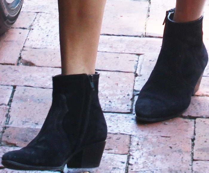 Kourtney Kardashian rocks suede cowboy boots from Saint Laurent