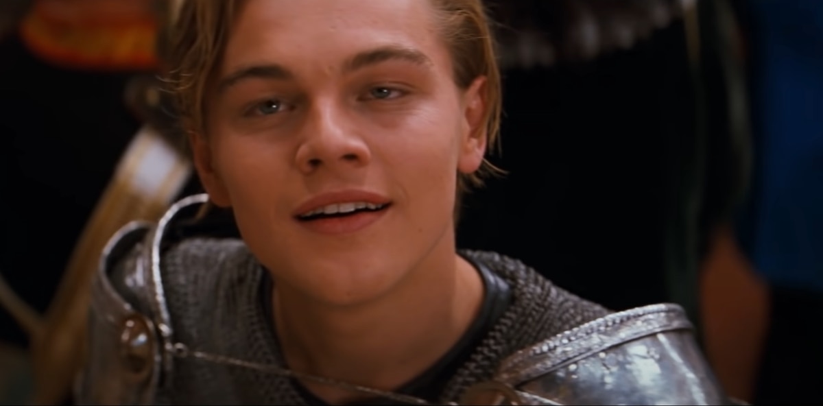 Leonardo DiCaprio, dressed as Romeo in silver chainmail armor, delivers one of his most iconic looks during the masquerade ball in Baz Luhrmann’s Romeo + Juliet
