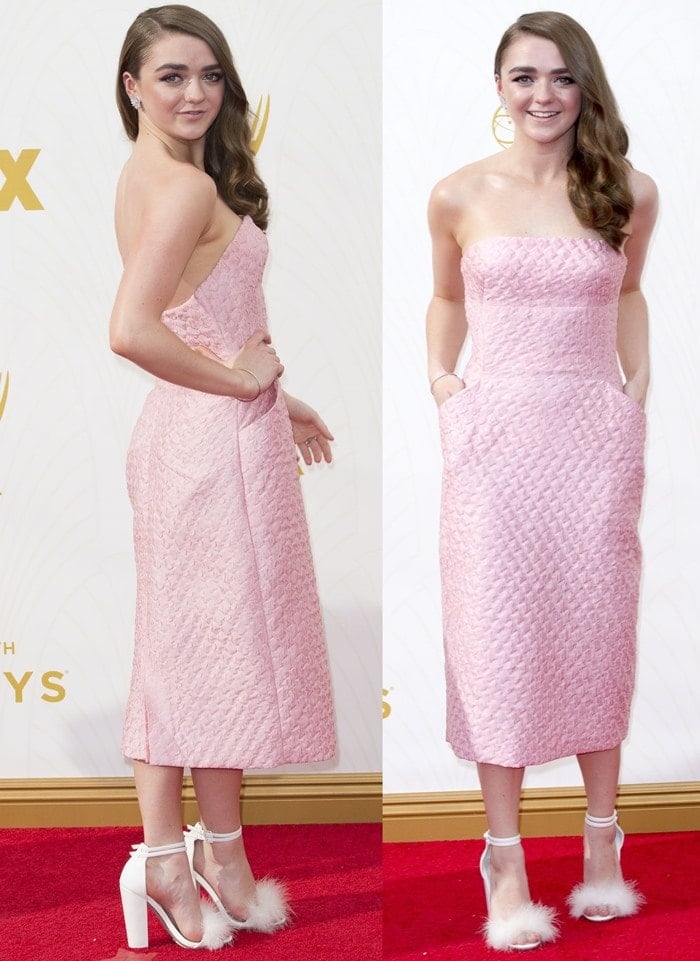 Maisie Williams turned heads in a quilted blush pink midi dress with pockets, playfully styled with whimsical white ankle-strap heels trimmed in fluffy faux fur