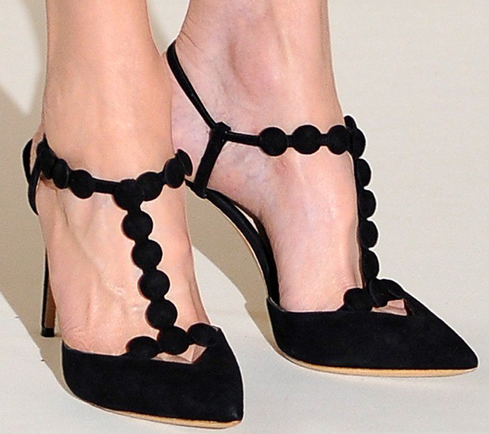 Nicole Kidman adds a playful twist to her look with Nicholas Kirkwood’s “Quantum” pumps, featuring suede T-bar straps dotted with sculptural circular appliqués