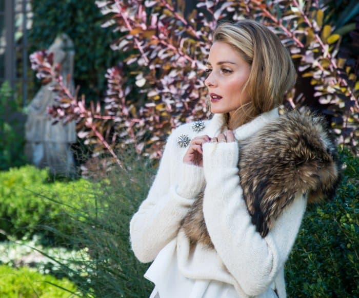 Olivia Palermo exudes effortless elegance in a cozy, fur-trimmed ensemble, highlighting her signature mix of classic and contemporary style