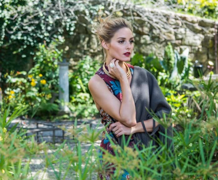 Olivia Palermo effortlessly combines elegance and nature in a vibrant floral dress, accessorized with a statement necklace from her BaubleBar collection