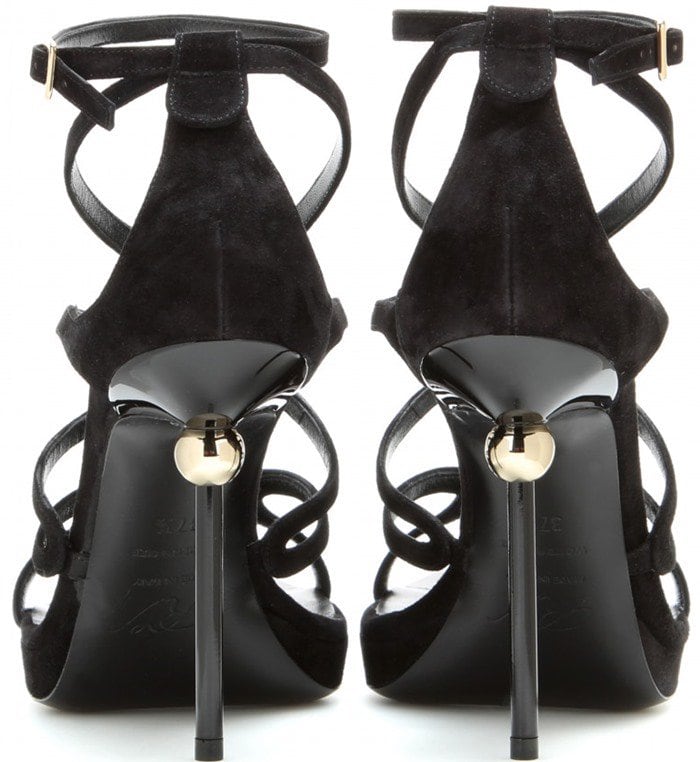 Roger Vivier “Ondulation” black leather sandals feature elegant wave-like straps that flow across the foot and a sculptural sphere heel inspired by the designer’s iconic Boule design