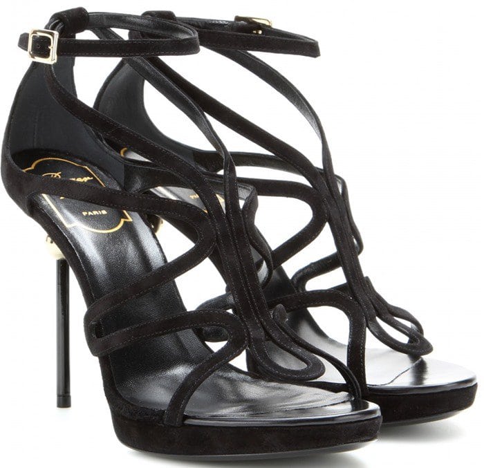 Roger Vivier “Ondulation” black leather sandals feature elegant wave-like straps that flow across the foot and a sculptural sphere heel inspired by the designer’s iconic Boule design