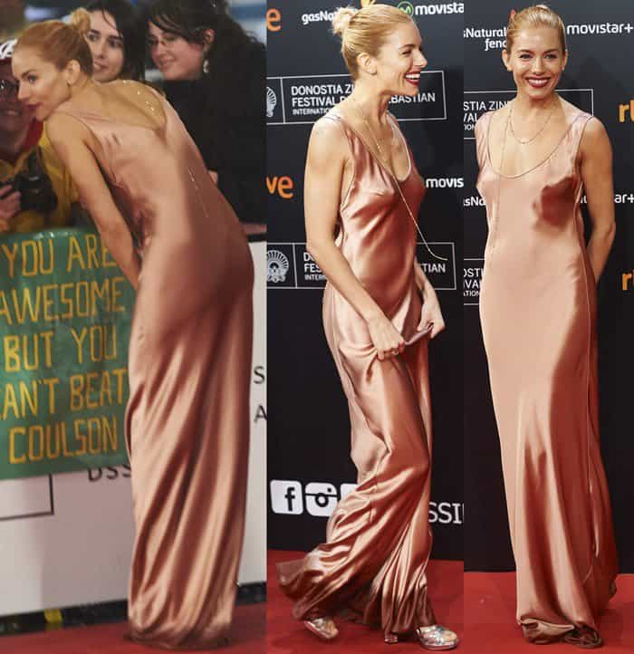Sienna Miller graced the red carpet in a copper-hued satin gown from the Galvan Spring 2016 collection, featuring a scoop-neck and a flowing silhouette, complemented by a delicate gold chain and metallic heels