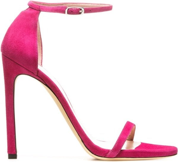 The Stuart Weitzman “Nudist” sandal in vivid geranium suede features a single-sole silhouette, slim ankle strap, and a sleek stiletto heel for a timeless, barely-there finish