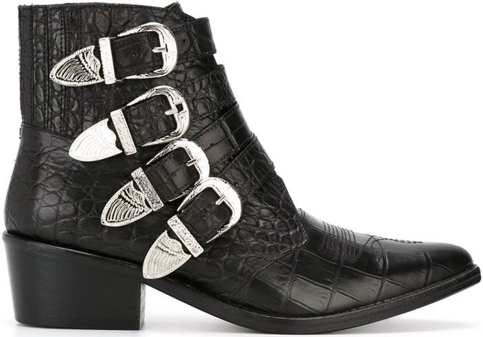 The embossed leather version showcases a textured finish paired with four oversized Western-style buckles