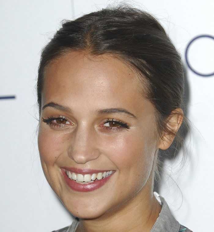 Alicia Vikander styled her hair in an elegant updo at the 2015 Elle Women in Hollywood Awards, showcasing her flawless fashion sense