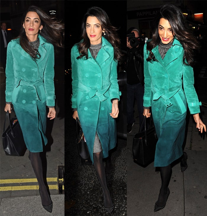Amal Clooney totes a Dolce Gabbana handbag and flaunts her legs in stockings and pumps