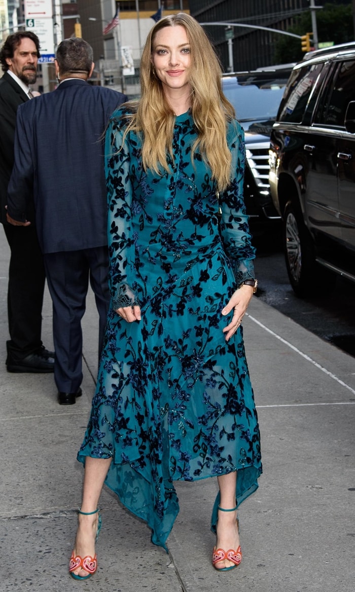 Amanda Seyfried steps out in New York City after The Late Show with Stephen Colbert on August 6, 2019, pairing a teal Chloé midi dress with Christian Louboutin Himaya mesh sandals for an elegant day-to-night finish
