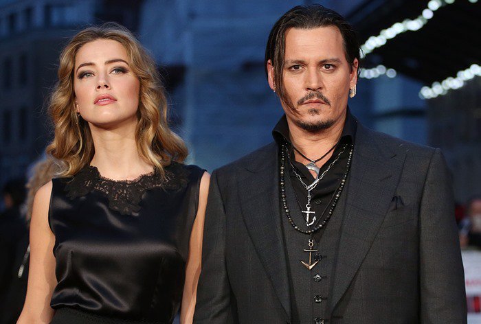 Thanks to her Jimmy Choo heels, Amber Heard appeared nearly eye-level with Johnny Depp, who stands 5ft 9 (175.3 cm), narrowing the couple’s natural height difference on the red carpet