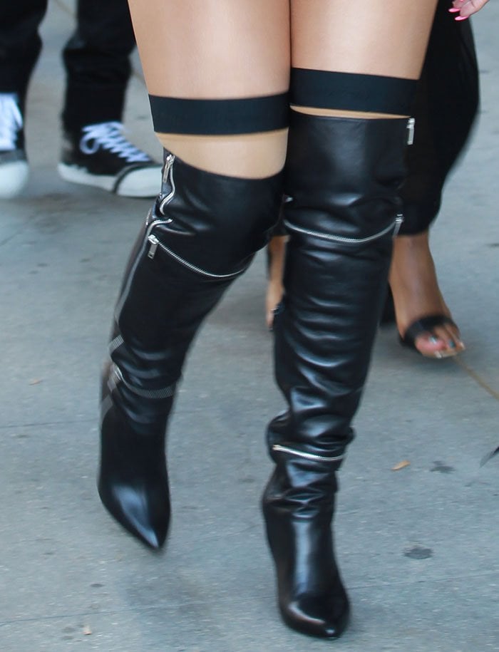 Amber Rose in Saint Laurent thigh-high boots