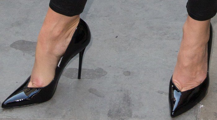 Cindy Crawford shows off her feet in sleek patent leather Stuart Weitzman "Venus" pumps, which, while undeniably stylish, didn’t look particularly comfortable