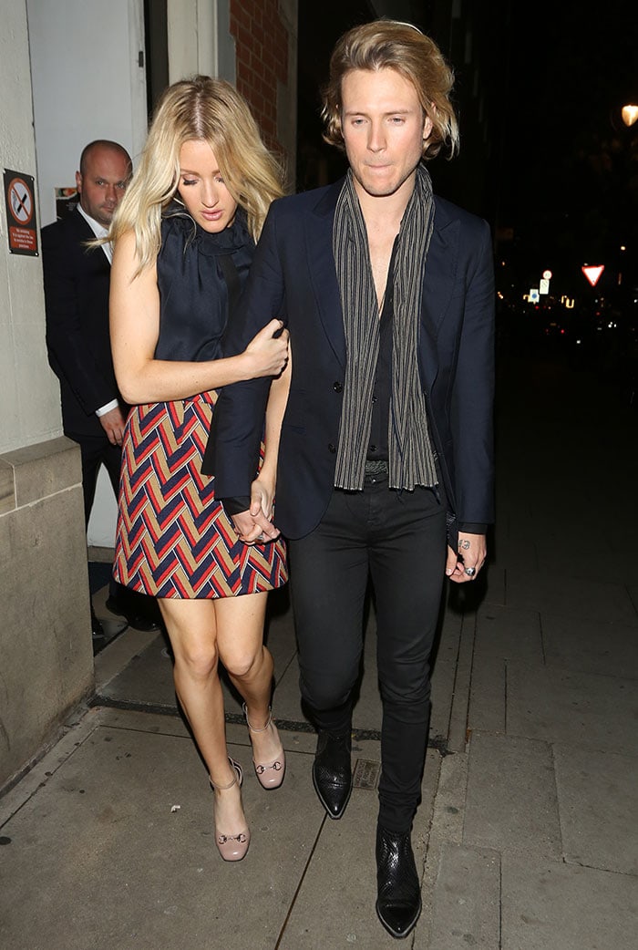 Ellie Goulding looked chic in a chevron-print mini skirt, navy ruffled top, and blush Gucci heels, while Dougie Poynter kept it edgy in a navy blazer, skinny jeans, and a striped scarf