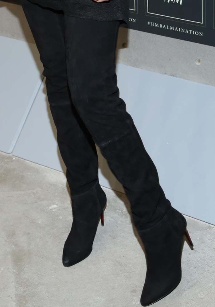 Gigi Hadid showcases her chic style with these sleek black over-the-knee boots