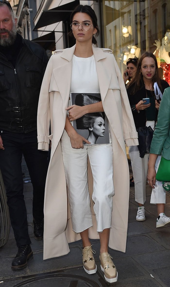 Kendall Jenner wearing Garrett Leight glasses and a white Asos jumpsuit