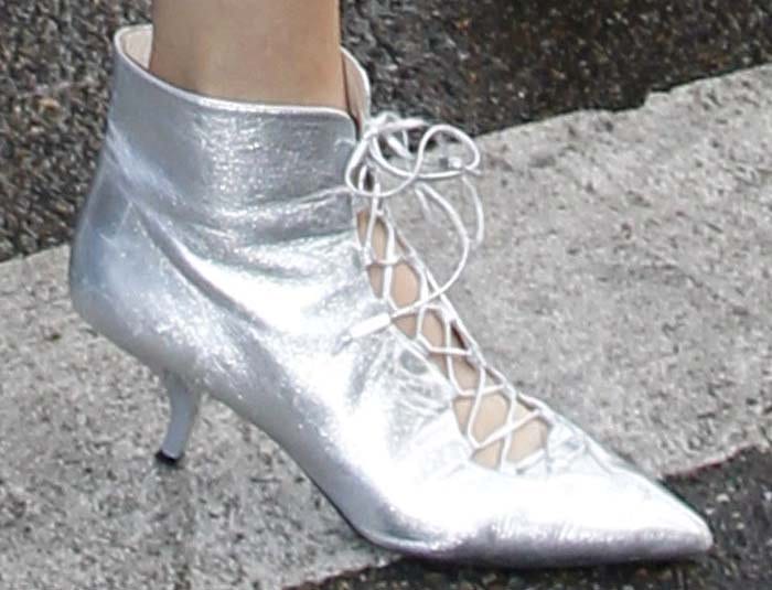 Kendall Jenner wearing silver lace-up heels