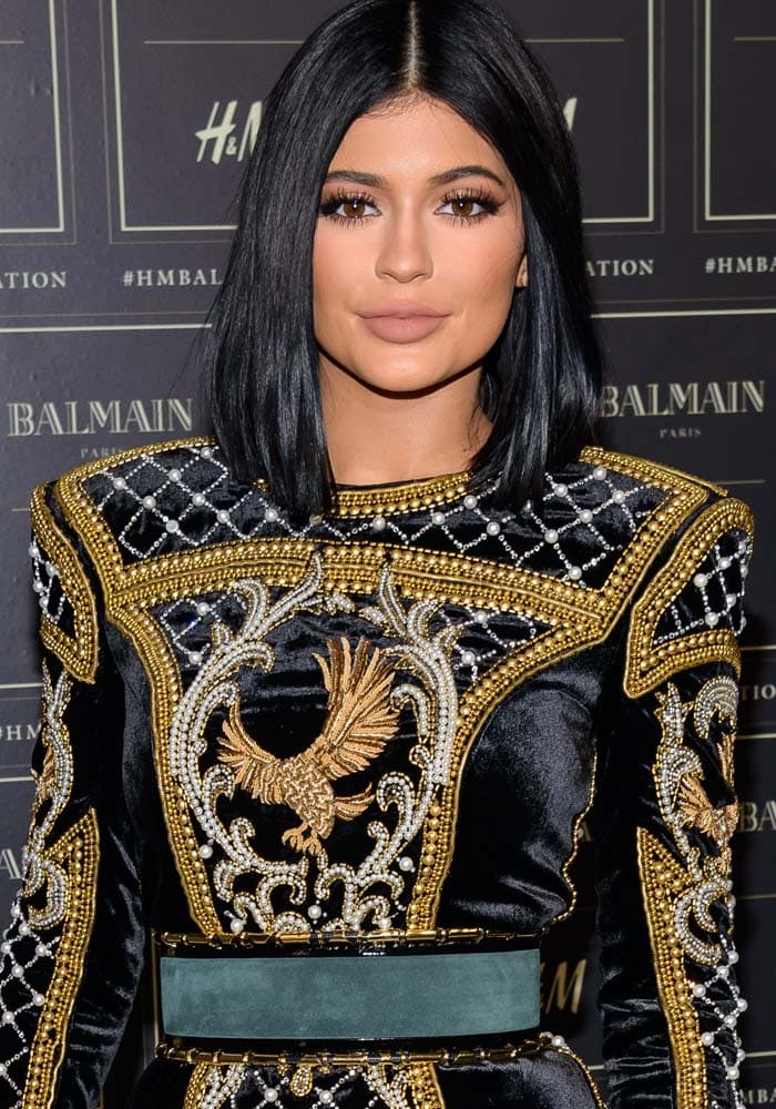 Kylie Jenner wore her hair with a center part at the Balmain x HM collection launch