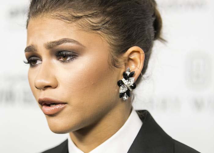Zendaya wears smoky eye makeup and statement earrings