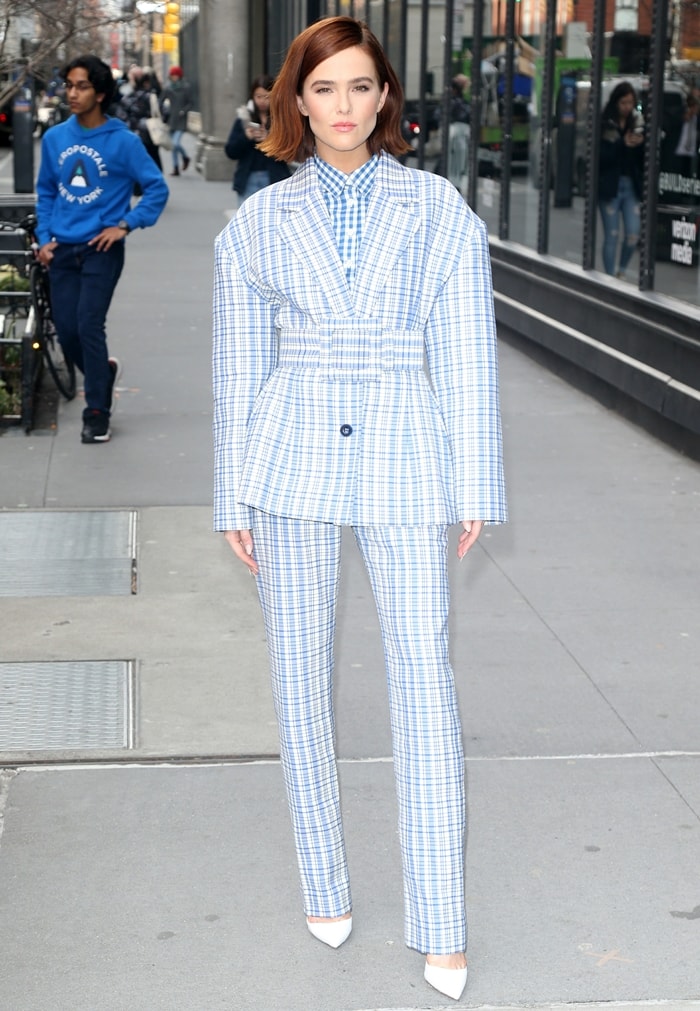 Zoey Deutch stepped into the Build Series studio in a sharply tailored Carolina Herrera plaid suit and crisp white pumps