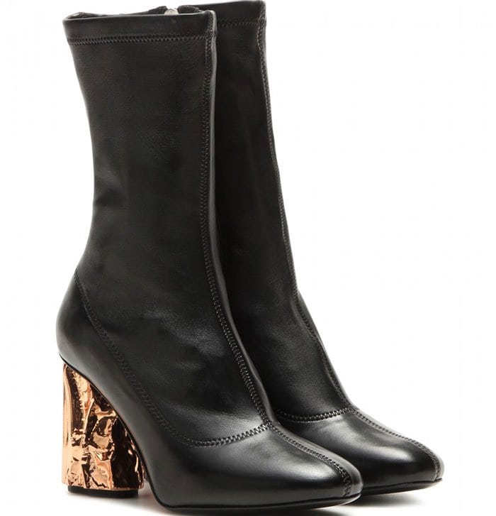 Acne Studios also released the “Odessa” boots in black leather, pairing the minimalist silhouette with sculptural metallic heels for a sharper, more futuristic look