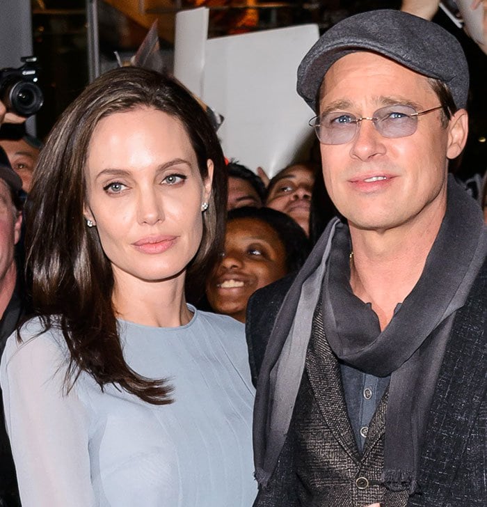 Angelina Jolie and Brad Pitt arrive in style at the screening of By the Sea in New York, with Angelina in a soft blue chiffon dress and Brad in a semi-casual layered ensemble complete with a scarf and flat cap