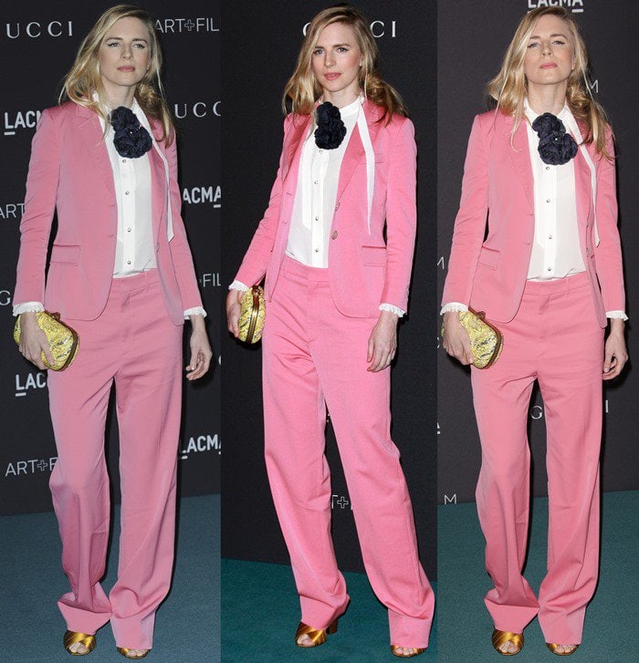 Brit Marling steps onto the LACMA Art+Film Gala carpet in a bubblegum-pink Gucci Resort 2016 suit, balancing oversized tailoring with a crisp white blouse and statement floral accent