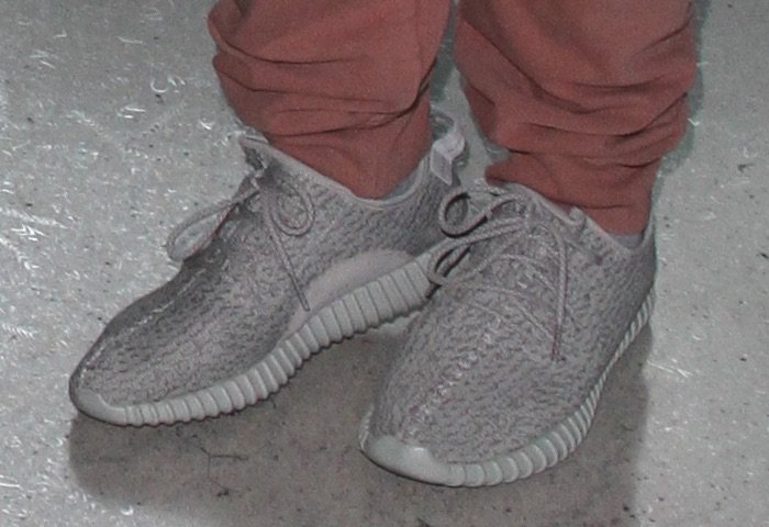 Corey Gamble's Adidas Yeezy Boost 350 "Moonrock" sneakers showcase the ribbed Boost sole and understated Agate Gray colorway that made the release a standout among early Yeezy drops