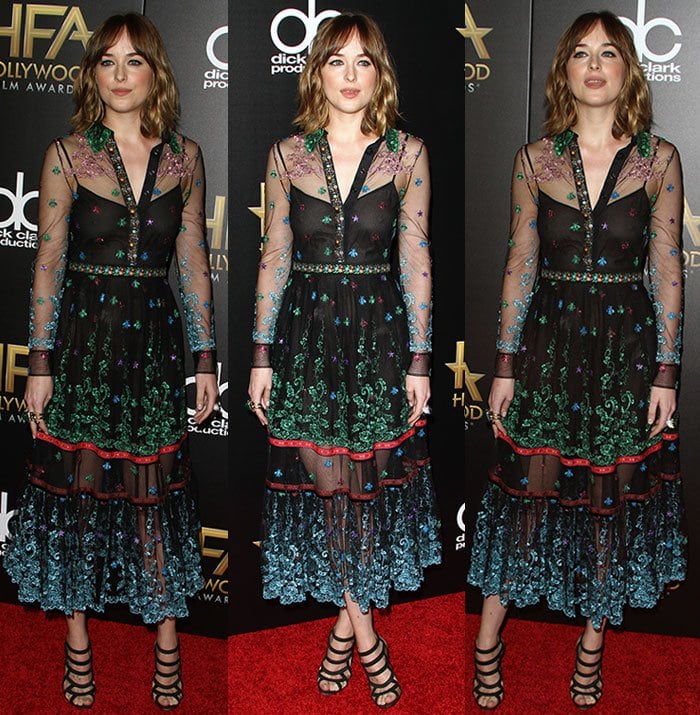 The sheer embroidered hem of Dakota’s dress reveals her Christian Louboutin “Nicobar” sandals and a glimpse of her foot tattoo